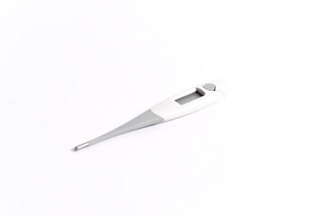 Electronic thermometer on a white background angle shot