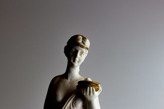 Greek statuette depicting a half-naked woman