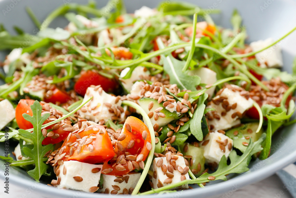 Wall mural Bowl with healthy vegetable salad, closeup