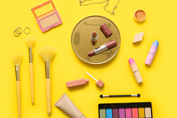 Decorative cosmetics on yellow background