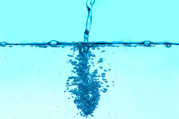 Clear water with air bubbles on blue background