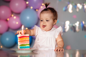 Fototapeta na wymiar Happy one year old baby with birthday cake. Children's birthday