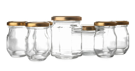 Different glass jars on white background