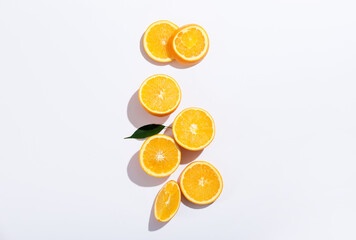 Fresh ripe cut oranges on white background