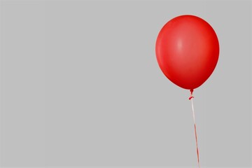 Red glossy flying balloon with ribbon. Helium balloon gift. Celebration concept. Holiday