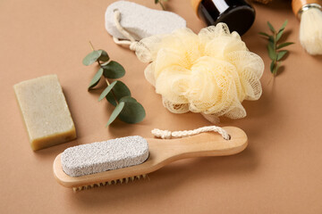 Bath supplies and eucalyptus branches on color background, closeup