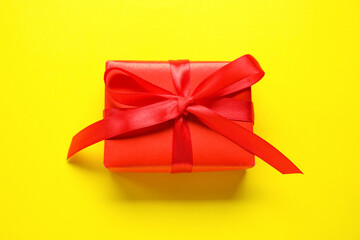 Gift box for Purim holiday on yellow background