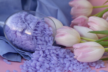 Spring depilation concept, tulips and wax. Set of depilation and beauty on blue spring removal waxing.