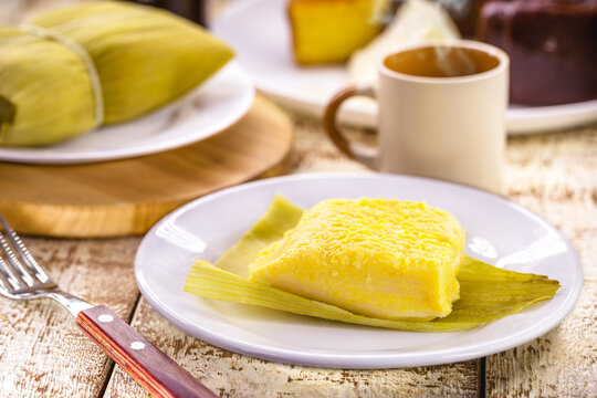 Brazilian sweet corn called Pamonha, made with fuba and corn, stuffed with cheese. Served with coffee, traditional Brazilian food
