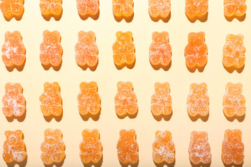 Orange jelly bears on light background
