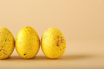 Yellow Easter eggs on color background, closeup