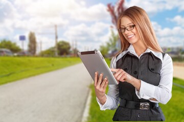 Fototapeta premium Optimistic brunette nice lady hold the digital tablet