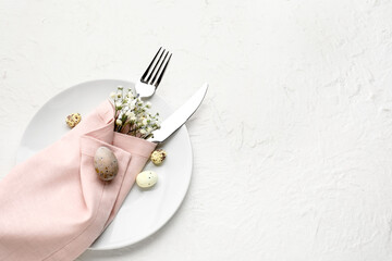 Stylish table setting for Easter celebration on light background