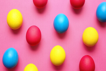Multicolored Easter eggs on color background