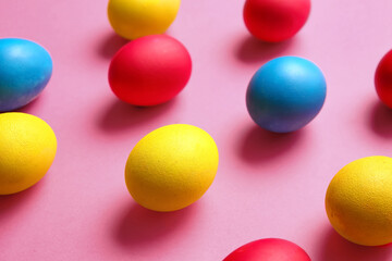 Multicolored Easter eggs on color background
