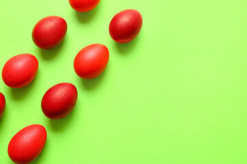 Red painted Easter eggs on color background