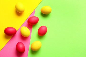 Red and yellow Easter eggs on color background