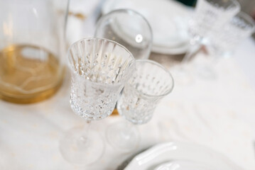 Table setting with dishes and glasses.