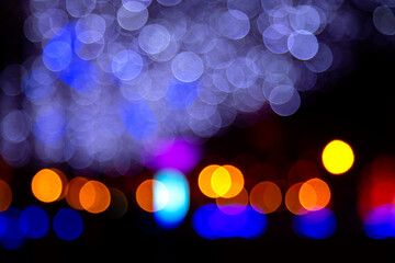 background blurred abstraction of colored lanterns and decorations. bokeh texture of street colored...