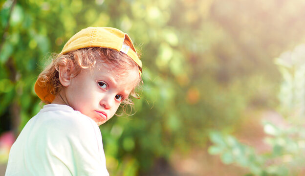 the offended child looked around with pouting lips