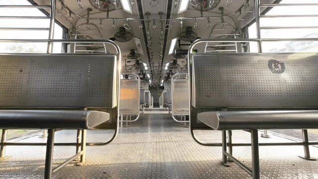 western railway Mumbai India empty morning wide shot local transport lifeline .