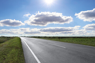 View of empty asphalt road on sunny day