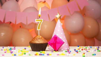 Decorations with balloons and a happy birthday candle with the number 7 years old for a child....
