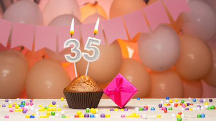 Decorations with balloons and a happy birthday candle with the number 35 for a woman. Happy...