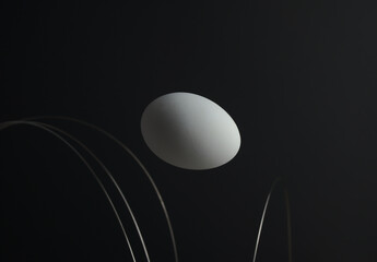 White egg with fly motion against black dark background with curved metal steel texture. Abstract concept of investment, fragile, light in dark, nutrition, healthy or ketogenic, or any egg concepts.