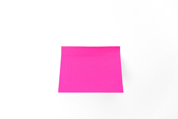 Pink sticker note to remind you of your thoughts or ideas on a white isolated background.
