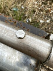 old rusty bolt on machine