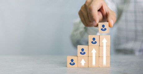 Recruiter complete team represented by wooden cube by one leader person (CEO) and icon,human...