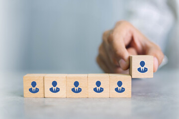 Recruiter complete team represented by wooden cube by one leader person (CEO) and icon,human...