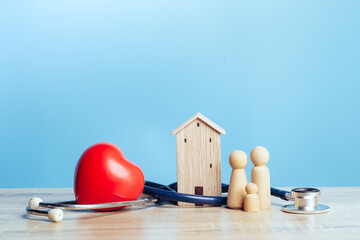 Home and family with a stethoscope and red heart Concepts about family health insurance.