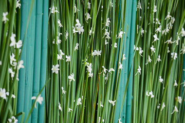 Floral arrangement at a wedding ceremony on beach.