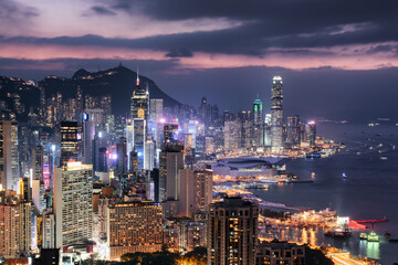 Obraz premium Colorful aerial view of skyscrapers in Hong Kong at sunset