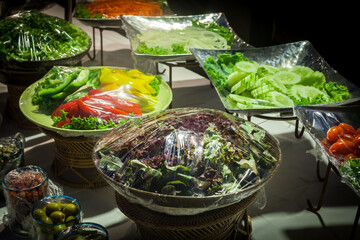 Vegetable salad on plastic wrap for buffet line in wedding party.