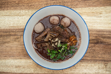 Fototapeta na wymiar Braised beef clear noodle with meat ball soup stew