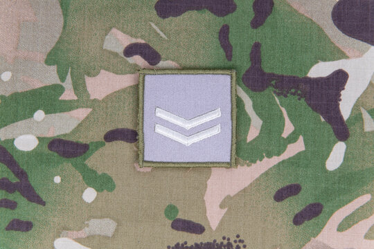 Corporal rank patch on military uniform