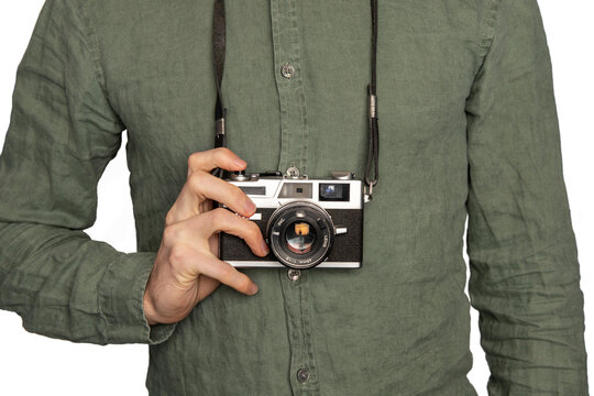 Film camera on photographer