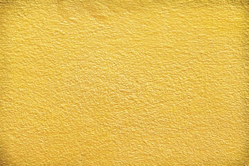 Gold paint cement wall texture with rough seamless patterns for colorful background