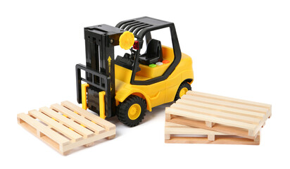 Toy forklift and wooden pallets on white background