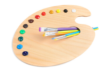 Palette with paints and brushes on white background, top view. Artist equipment
