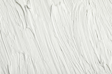 Texture of white oil paint as background, closeup