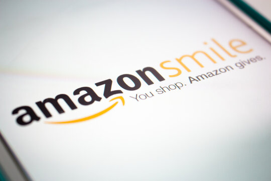 Kumamoto, Japan - Jun 26 2020 : The logo of Amazon Smile (AmazonSmile), charity initiative to donate 0.5% of the sale price of eligible items to the customer's selected charity as its sponsor, on iOS.