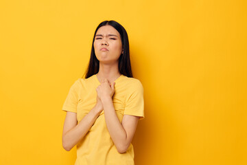 woman posing emotions problems studio yellow background unaltered