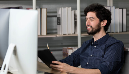 Fototapeta premium Caucasian happy male bearded trader investor freelancer smiling sitting typing data information on computer working at home office selling trading buying stock exchange for client and customer.