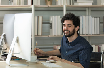 Caucasian happy male bearded trader investor freelancer smiling sitting typing data information on computer working at home office selling trading buying stock exchange for client and customer.