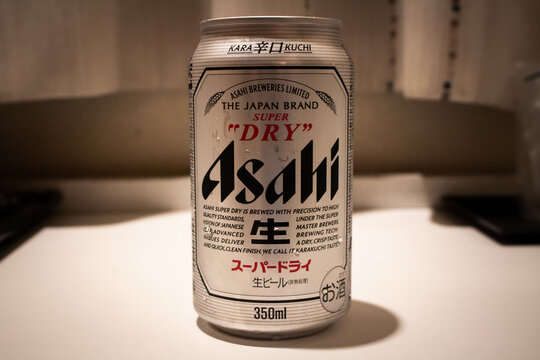 Shimonoseki, Yamaguchi / Japan - Aug 13 2020 : The can of Asahi Super Dry, a highly attenuated lager by Japanese beer brewing company Asahi Group Holdings, Ltd., on the table at motel.