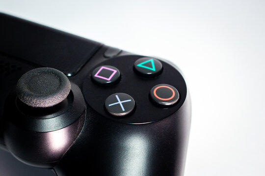 Kumamoto, Japan - Jul 29 2020 : The rough image of DualShock 4 controller on the table. PlayStation 4 (PS4) is an 8th-gen home video game console developed by Sony Computer Entertainment.